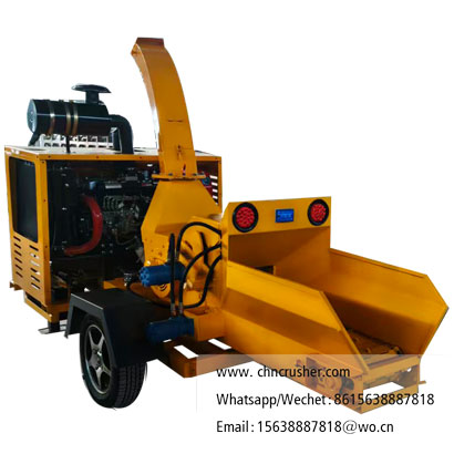Chain conveyor fed wood chipper