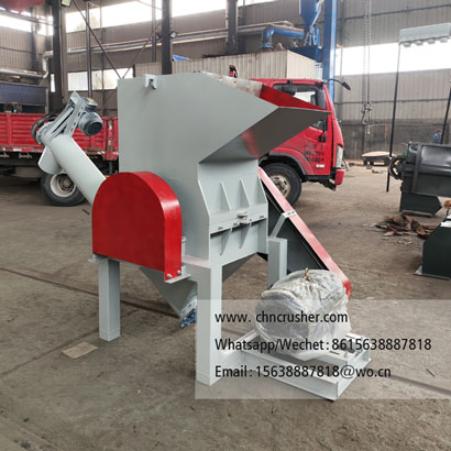Spiral discharge woven bag shredder