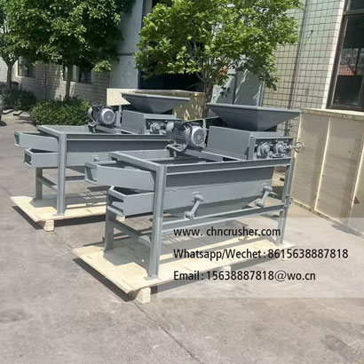 Machine for cracking fruit pits and nut shells to extract kernels