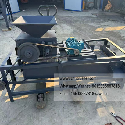 Machine for cracking fruit pits and nut shells to extract kernels