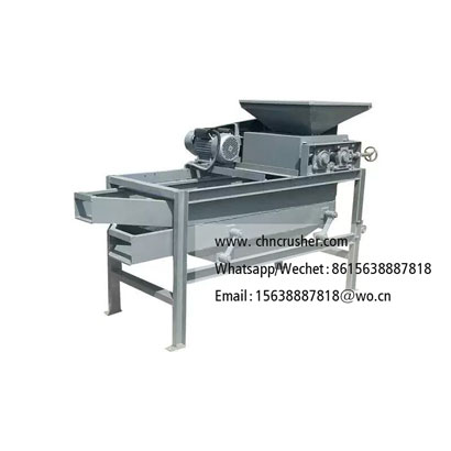 Machine for cracking fruit pits and nut shells to extract kernels